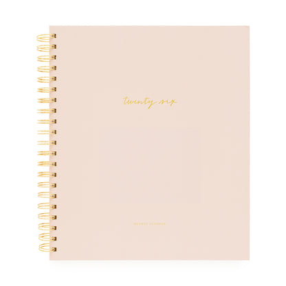 Blush planner with gold spiral binding and 'twenty-six' on cover