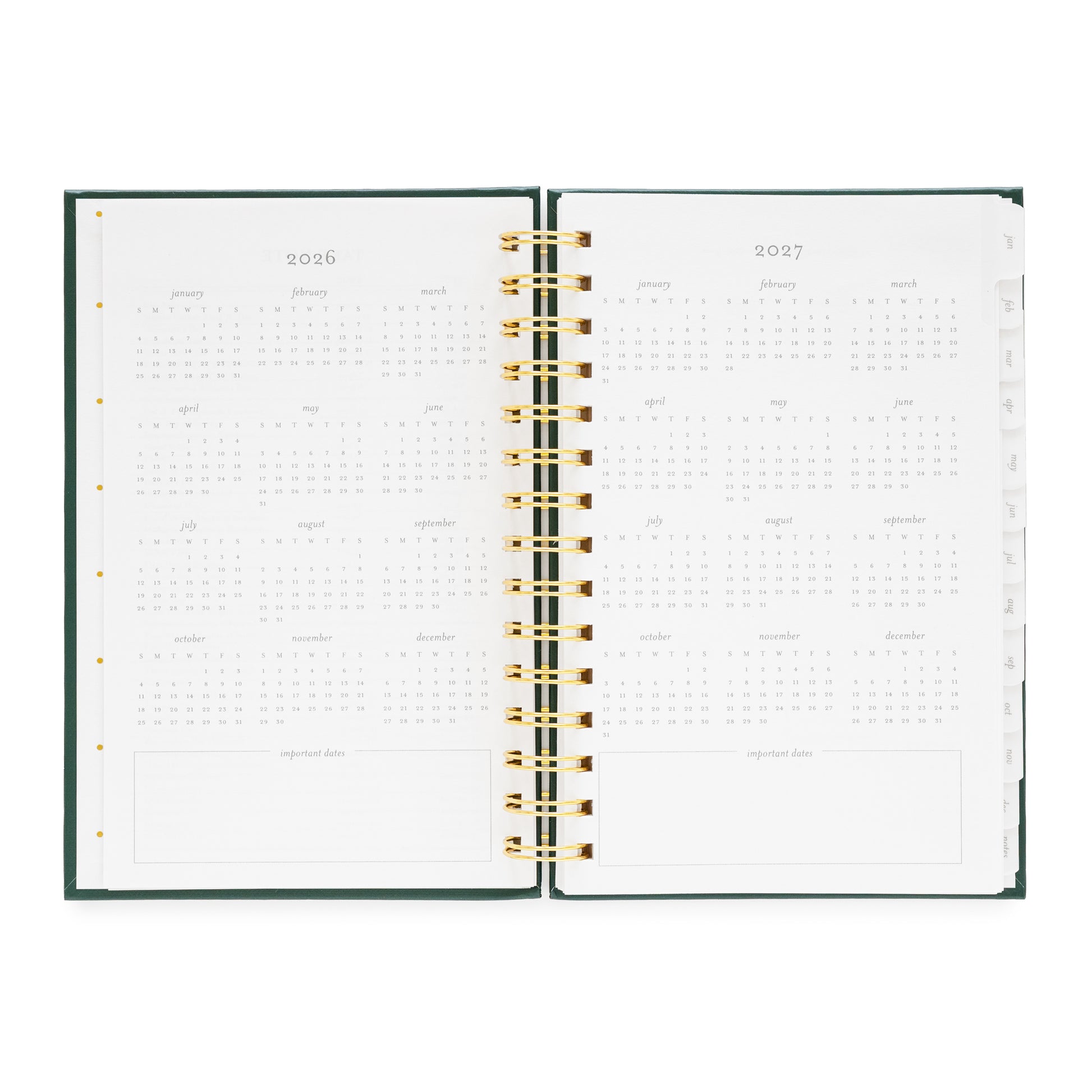 Open small spiral planner showing pages for 2026 and 2027 months