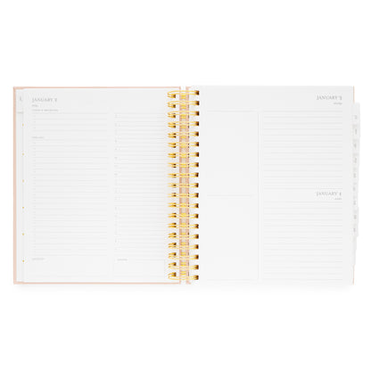 Open spiral planner with daily page with today's priorities, the list, grateful for, timed slots for planning, and dinner plans for each weekday and extra space for each weekend date