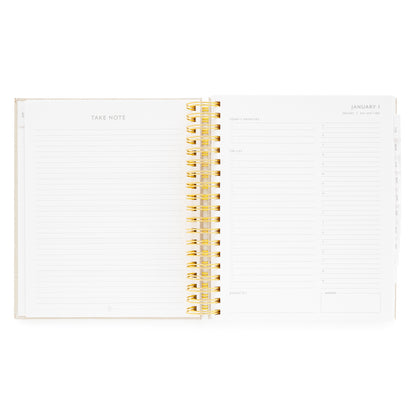 Open spiral planner with take note lined page and daily page with today's priorities, the list, grateful for, timed slots for each weekday, and dinner plans