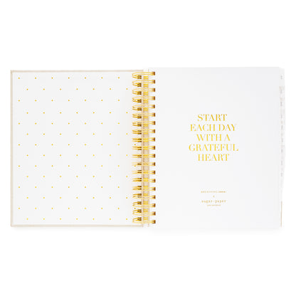 Daily spiral planner with gold spiral binding and 'Start Each Day With A Grateful Heart' in gold foil