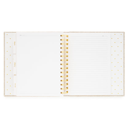 Open concealed agenda with extra blank pages and lined note pages in the back