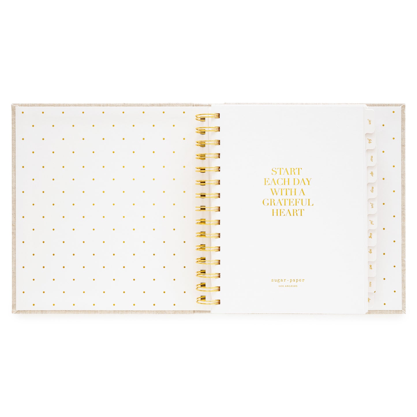 Interior of open concealed agenda with title quote of "start each day with a grateful heart" in gold foil