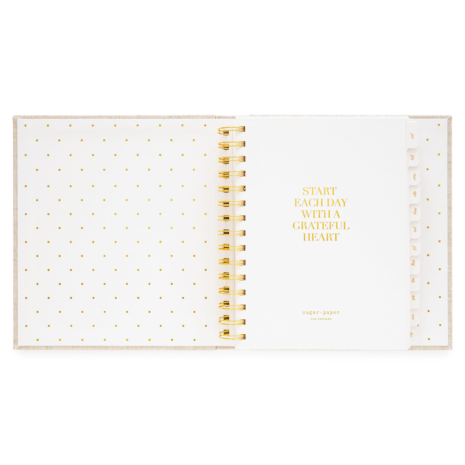 Interior of open concealed agenda with title quote of "start each day with a grateful heart" in gold foil