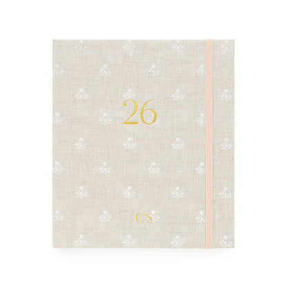 2026 fabric planner with beige and white floral pattern and '26' and 'cs' initials stamped in gold foil