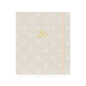Beige and white floral pattern fabric planner with the gold foil 26 on the cover