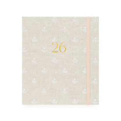Beige and white floral pattern fabric planner with the gold foil 26 on the cover