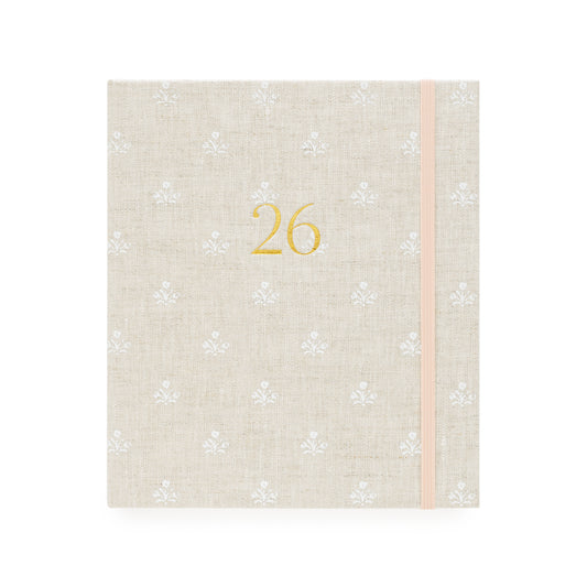 Beige and white floral pattern fabric planner with the gold foil 26 on the cover