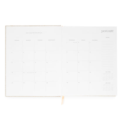 Interior of desk agenda with january monthly grid with space for notes and inspirational quote