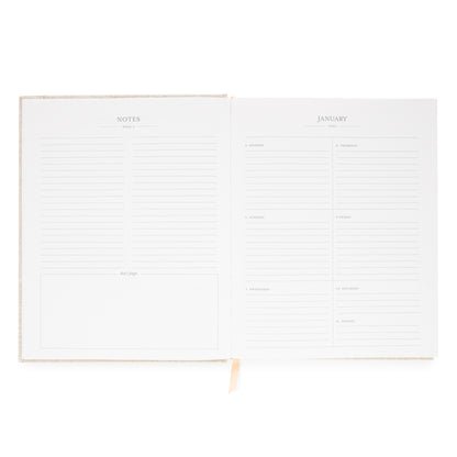 Interior of desk agenda with notes, dont' forget and weekly layout for january 2026 with space for each day of the week