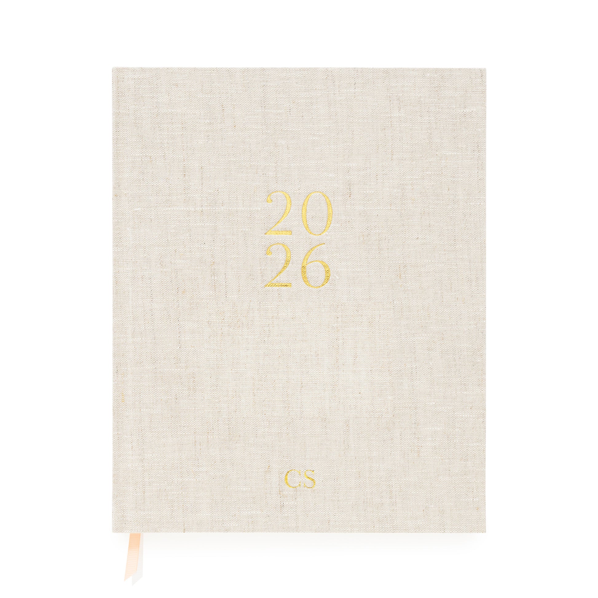 Flax desk agenda cover foil stamped with 2026 in gold foil with gold 'CS' initials and pink and white ribbon markers