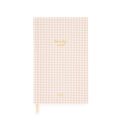 Pink and white gingham agenda with gold foil twenty six and 'CS' personalized initials in gold