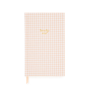Pink and white gingham fabric planner with twenty six foil stamped on the cover