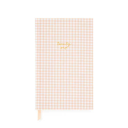 Pink and white gingham fabric planner with twenty six foil stamped on the cover