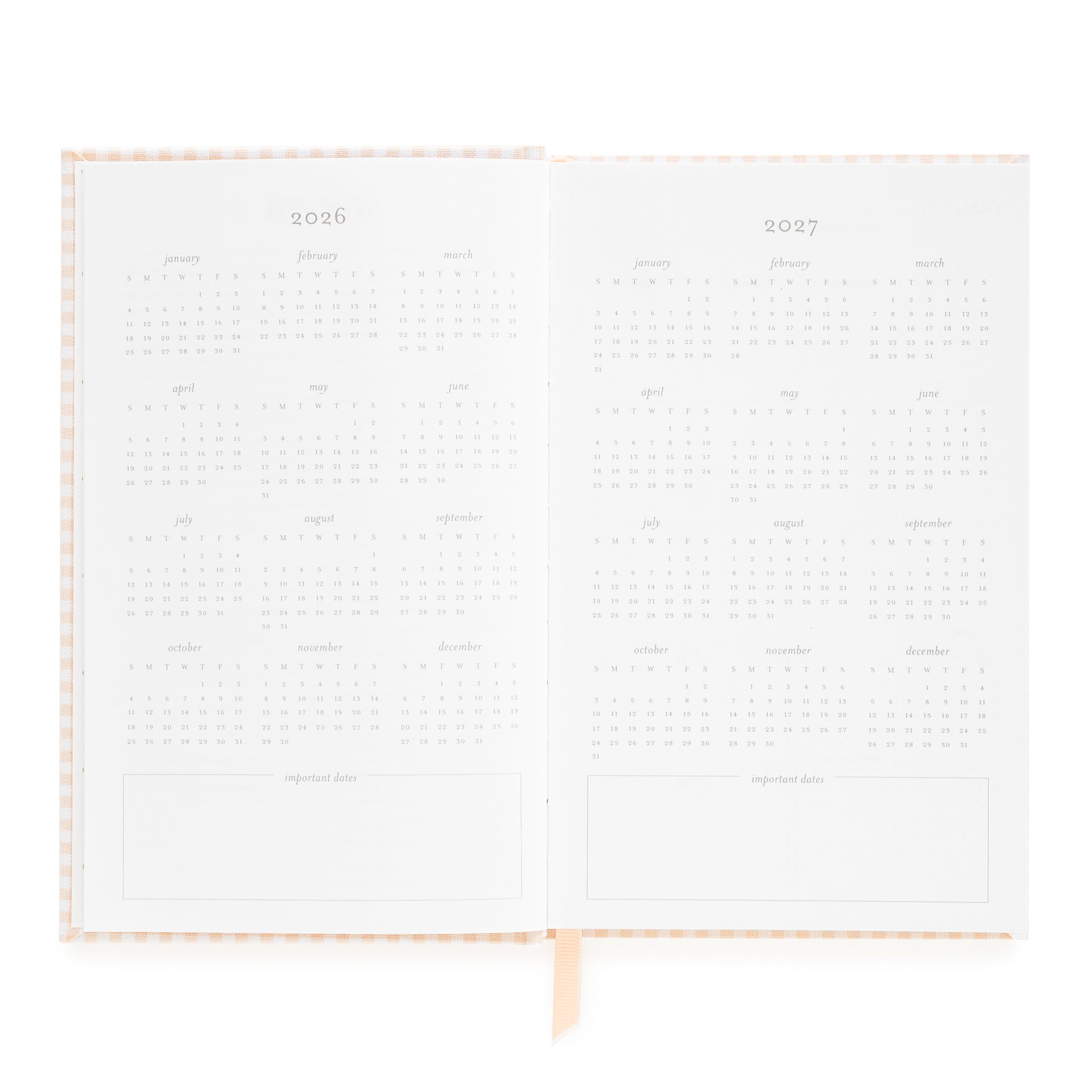 Open small bound agenda with 2026 + 2027 months of the year