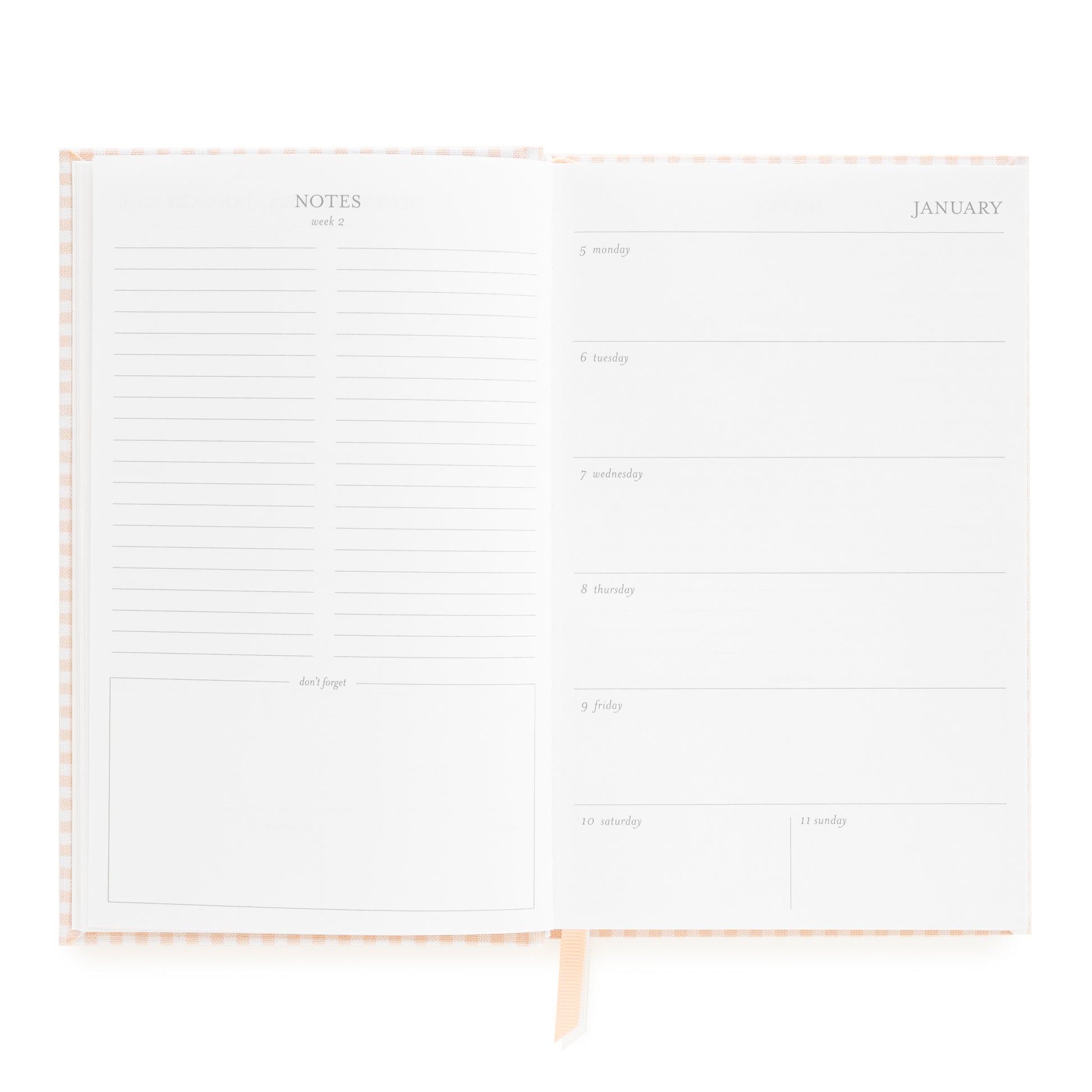 Open small bound agenda with weekly notes page and weekly space for each day of the week