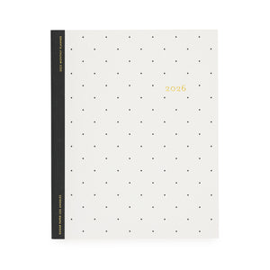 White planner with black dot pattern and '2026' gold foil on cover