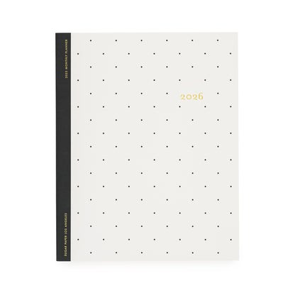 White planner with black dot pattern and '2026' gold foil on cover