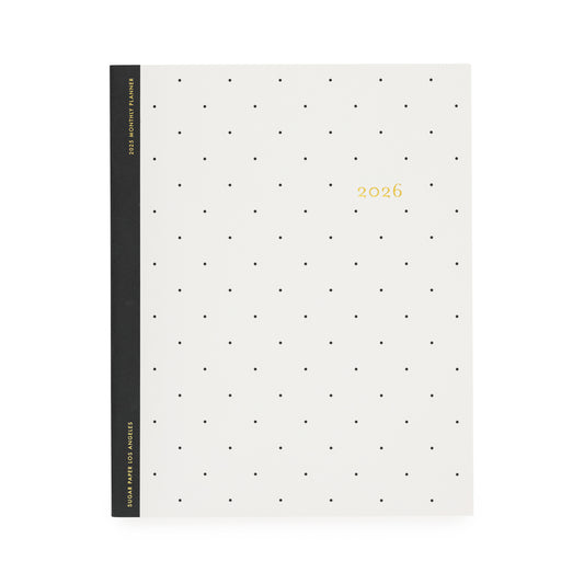 White planner with black dot pattern and '2026' gold foil on cover