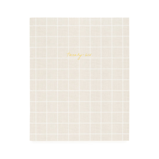 Flax and white check planner with twenty-six in gold foil on the cover