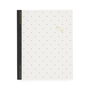 White planner with black dot pattern, black tape binding, and gold foil 26/27