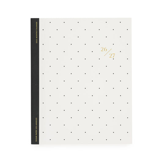 White planner with black dot pattern, black tape binding, and gold foil 26/27