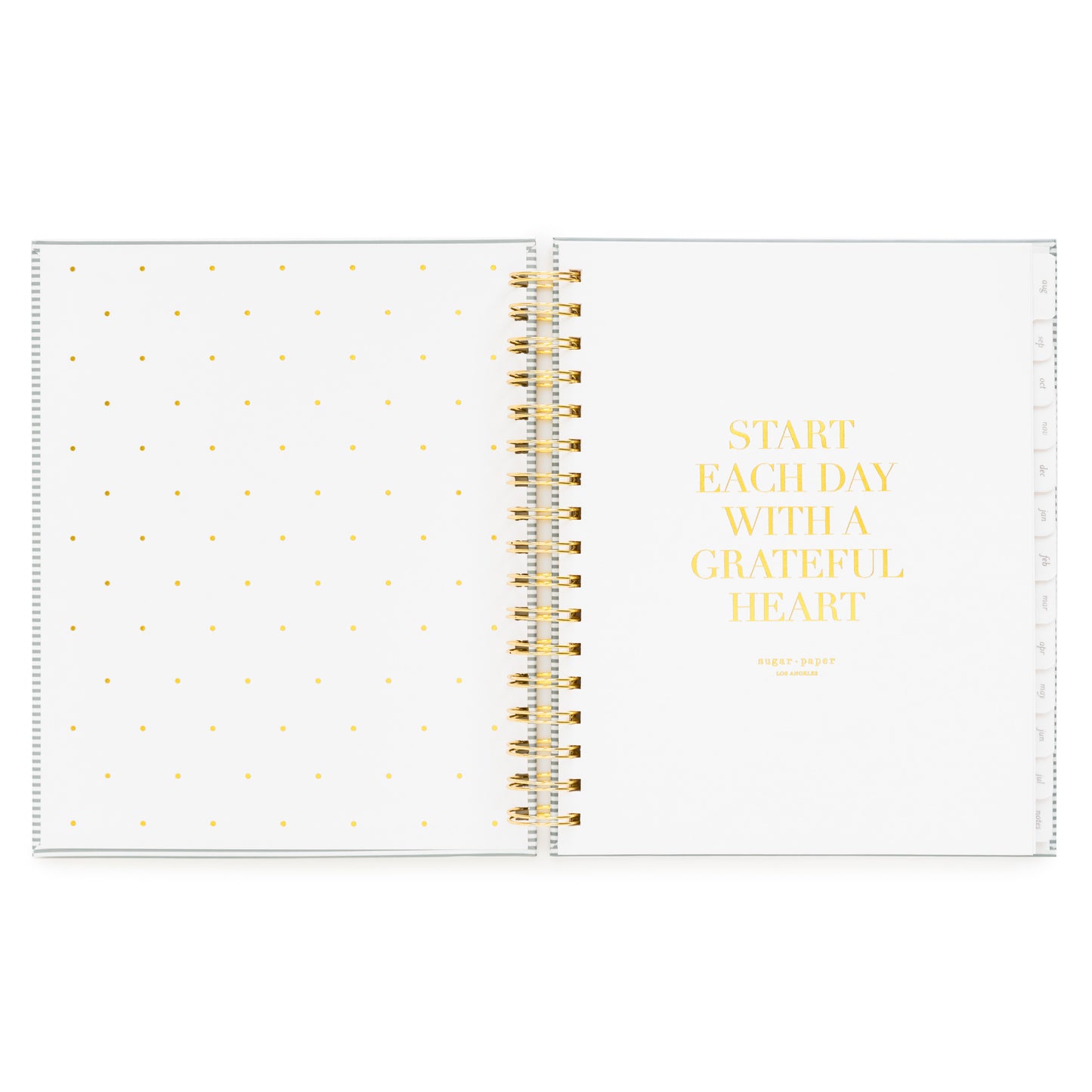 Open front cover page of the academic planner 'start each day with a grateful heart' quote in gold foil