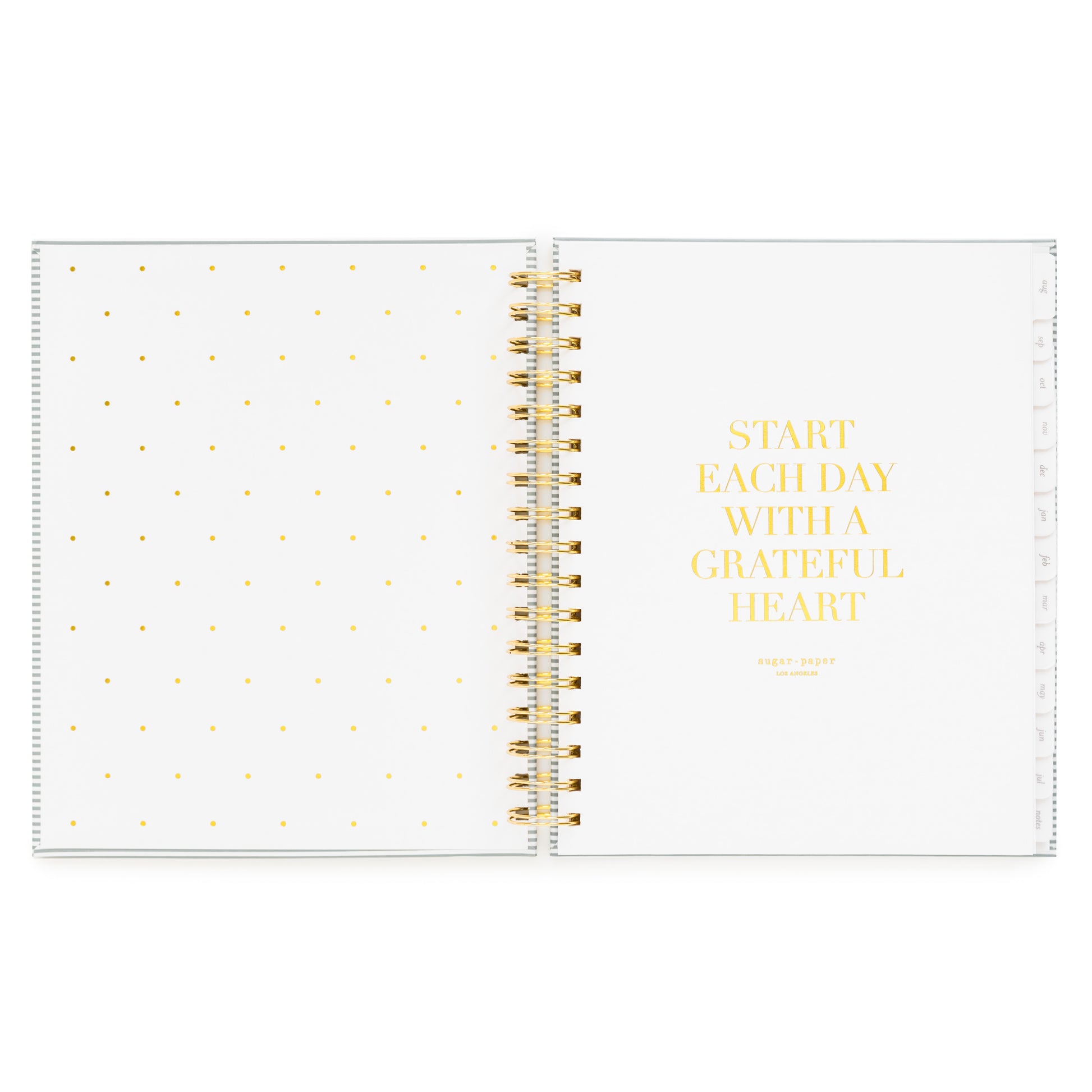 Open front cover page of the academic planner 'start each day with a grateful heart' quote in gold foil