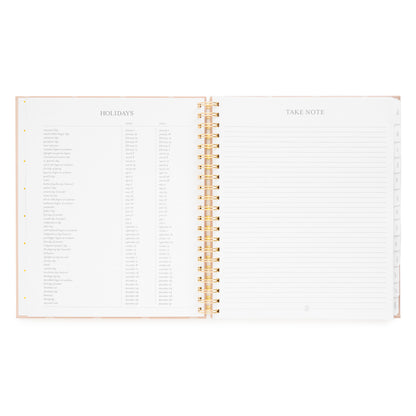 Open spiral planner with holiday layout for 2026 + 2027 calendars and take note with lined notes on the right