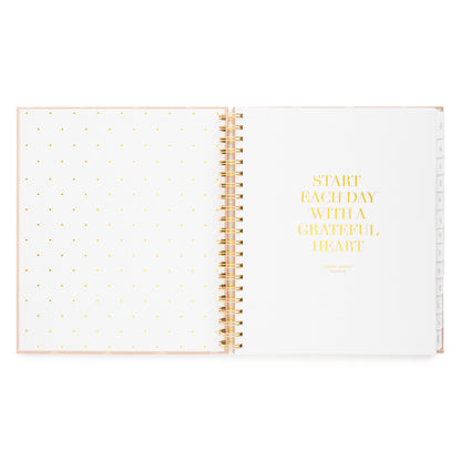 Open spiral planner with 'start each day with a grateful heart' with cover page in gold foil