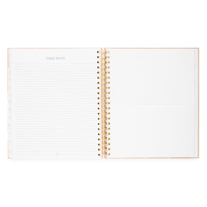 Open spiral planner with take note page on the left and pocket on the right