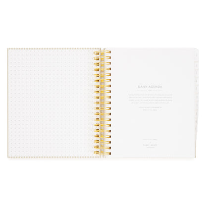 An open daily agenda with white dotted pages on the left and a title page on the right with 'daily agenda 2027' and a quote from Holly Blakey about project planning