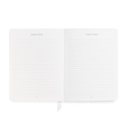 An open planner with lined pages and the words 'TAKE NOTE' printed at the top of each page with ruled lines for note taking