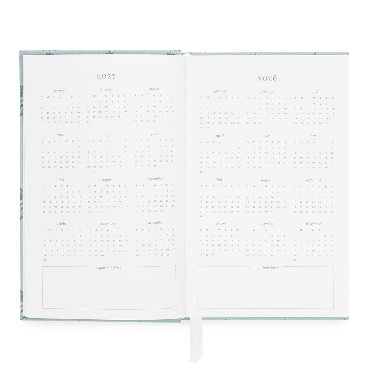 An open 2027 to 2028 calendar spread with minimalist monthly grids and blank note sections at the bottom of each page