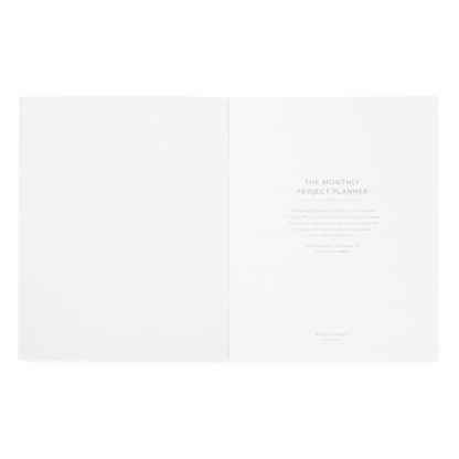 A minimalist open monthly project planner with 'the monthly project planner' and a blurb about the partnership with 'holly blakey'