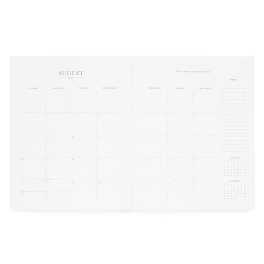 Interior of monthly planner with a monthly grid for August 2026, an inspirational quote, and notes on the side