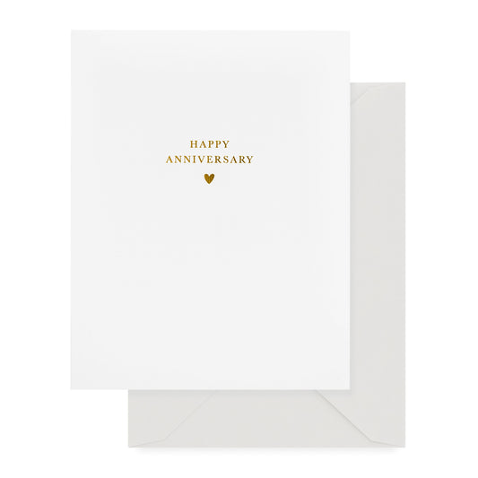white anniversary card with gold foil text and antique grey envelope