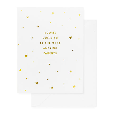 white card with gold foil text and heart pattern, white envelope