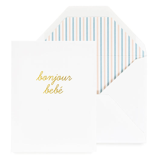 white card with gold bonjour bebe text, white envelope with striped envelope liner