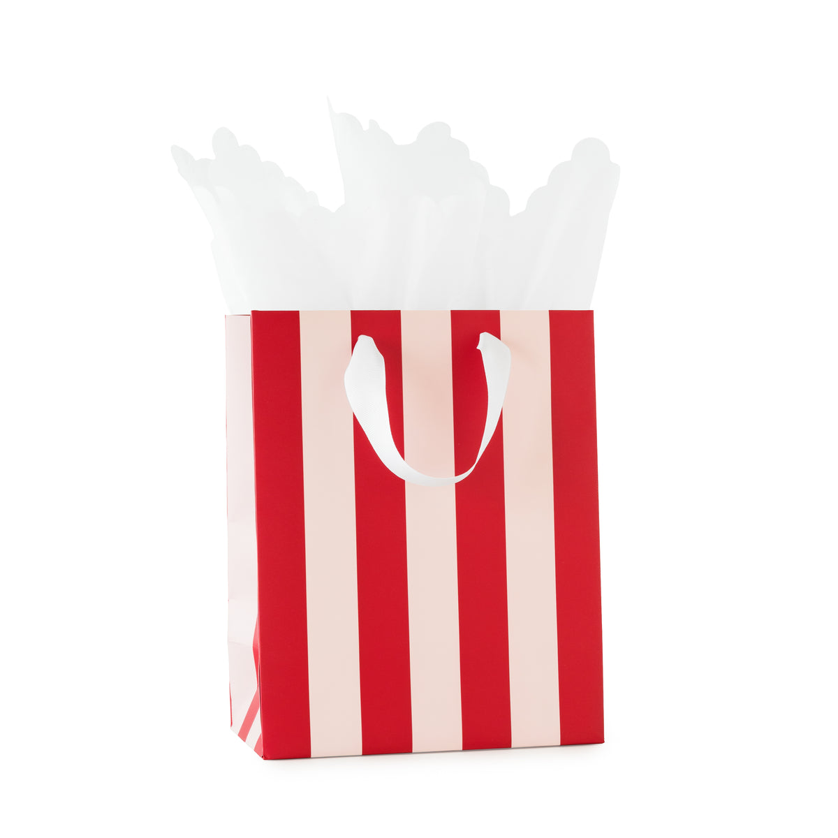 A red and white striped paper gift bag with white handles and white tissue paper