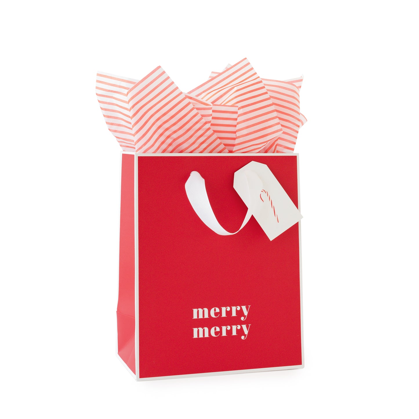 Red gift bag with white piping edge printed with 'merry merry' in white filled with red stripe tissue paper and a white gift tag with a pink and red candy cane