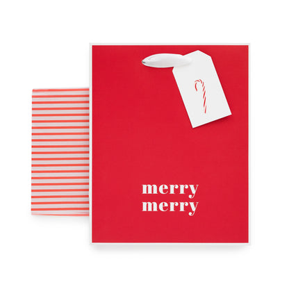 Red gift bag with white piping edge printed with 'merry merry' in white paired with red stripe tissue paper and a white gift tag with a pink and red candy cane