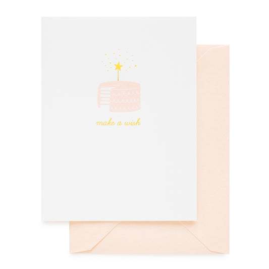 Pale pink birthday cake with gold star candle card
