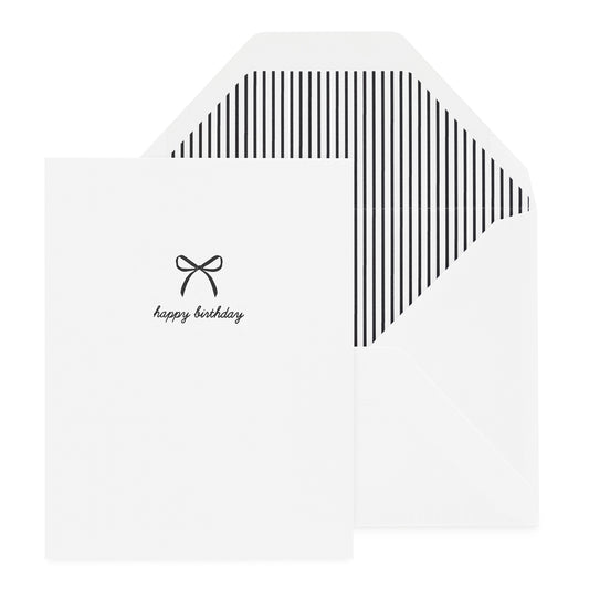 Black letterpress bow and happy birthday in script printed on a white card with a black stripe envelope liner