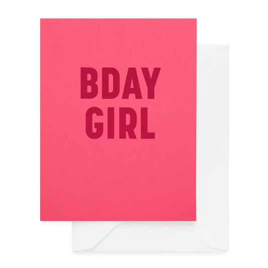 Hot pink card printed with red foil bday girl paired with a white envelope