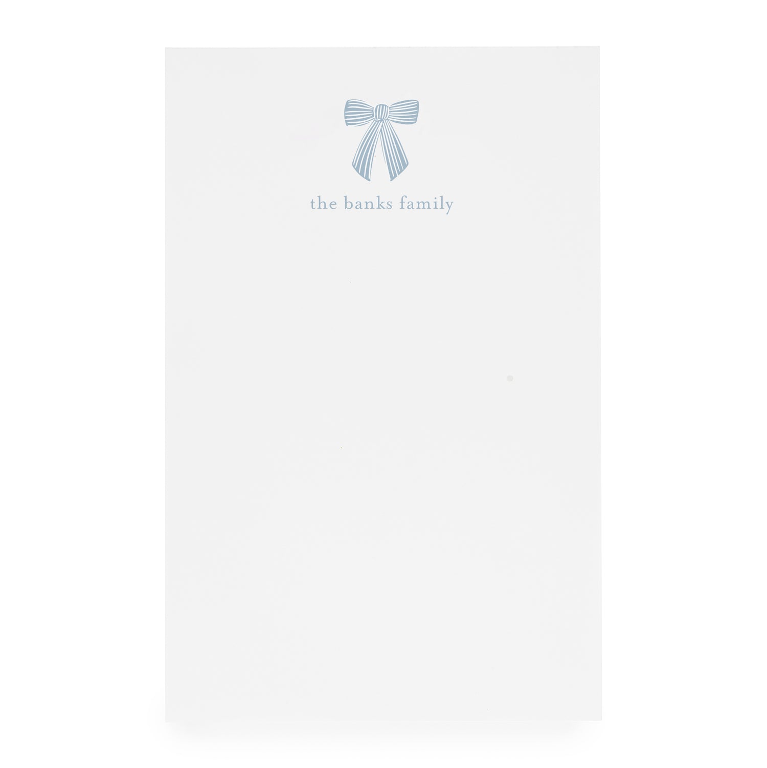White paper with a blue bow design and 'the banks family' text on white paper}