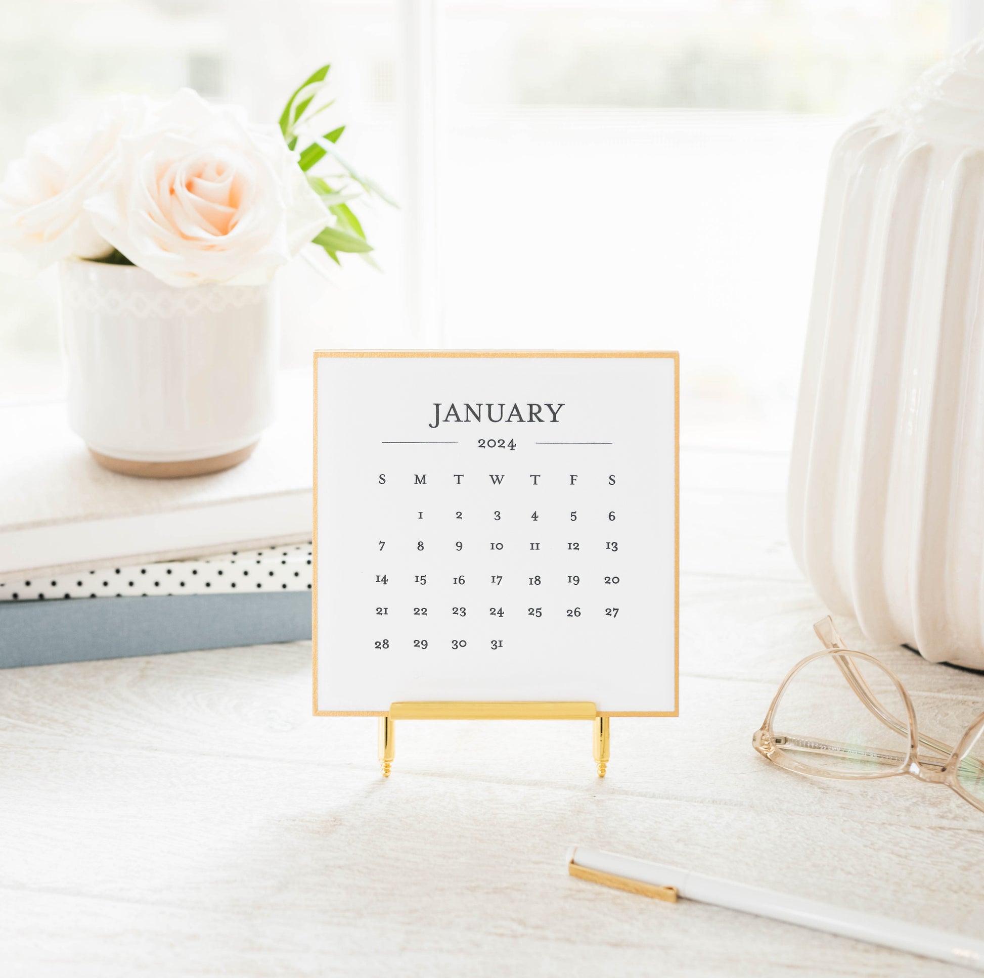 2024 desk calendar on stand on desk