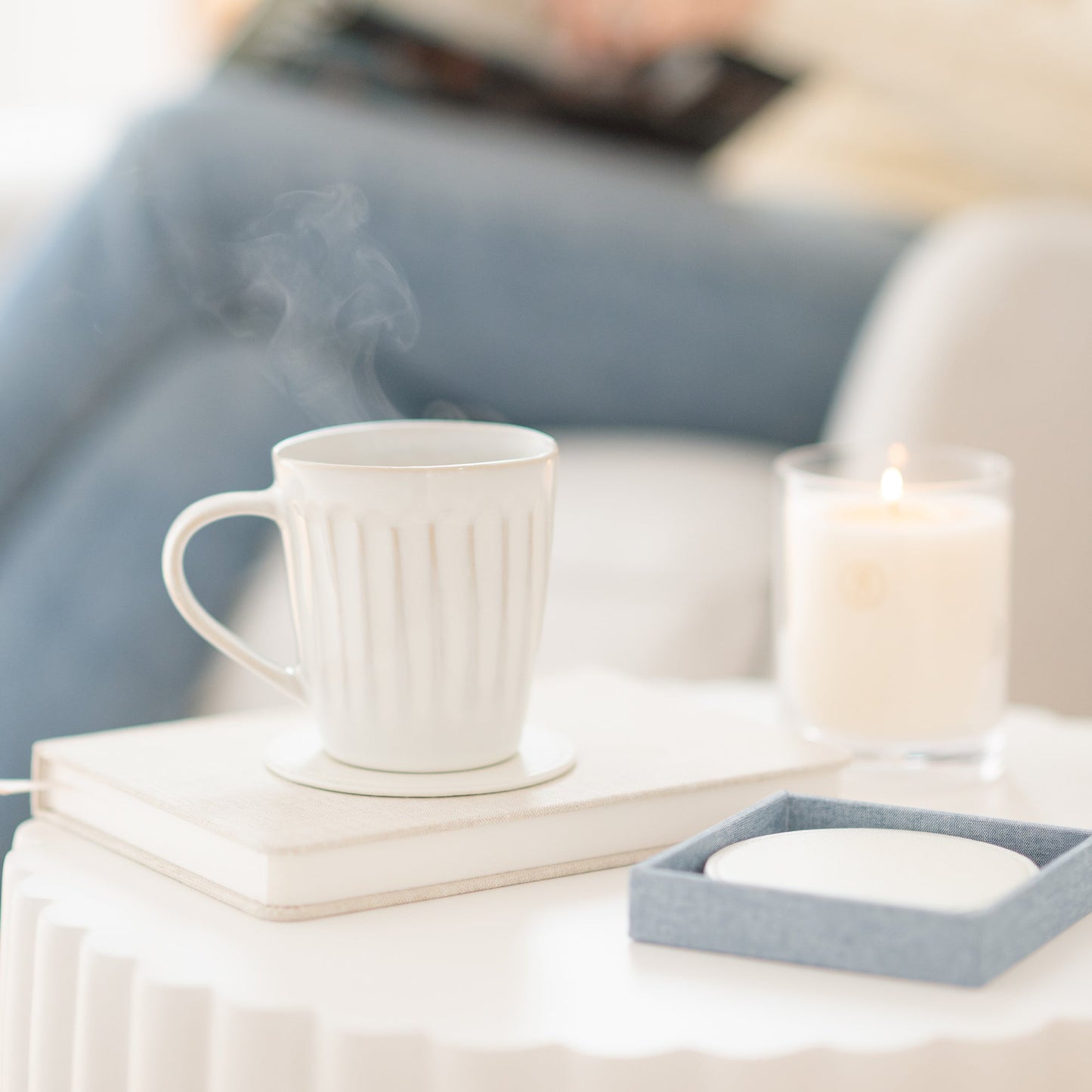 White coasters on journal with coffee mug