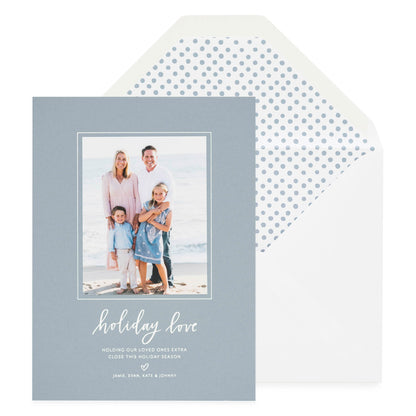 Slate blue and white holiday photo card printed with holiday love and blue dot liner