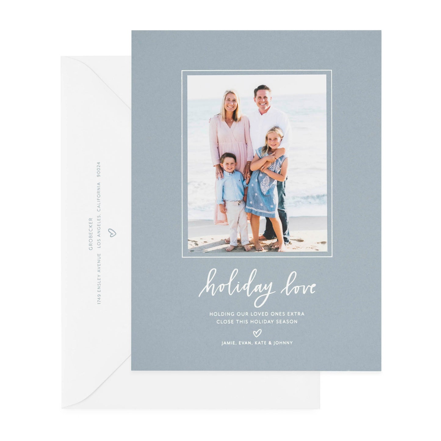 Slate blue and white holiday photo card printed with holiday love paired with a white envelope